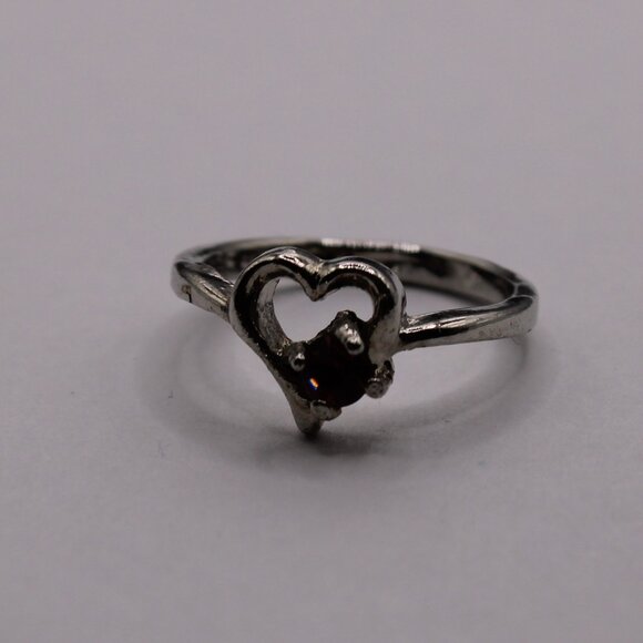 18252-US 4.5 Heart with a CZ Purple diamond inside the ring. - Picture 1 of 3